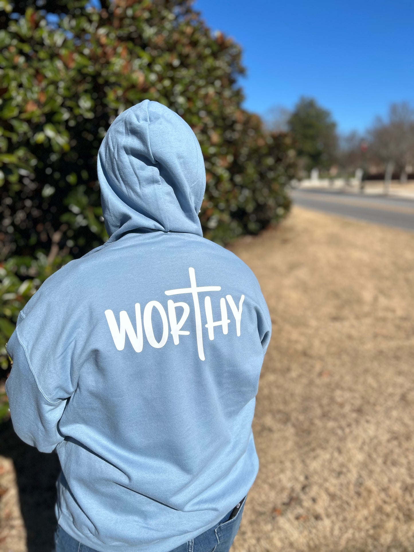 Stone Blue hoodie with the word "Worthy" in white on the back.